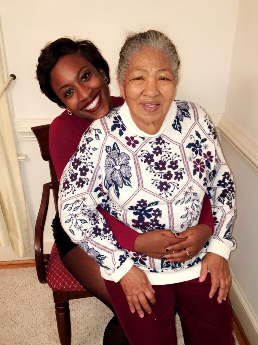 Kirsten with her grandmother Valma, leaning over her shoulder, both laughing
